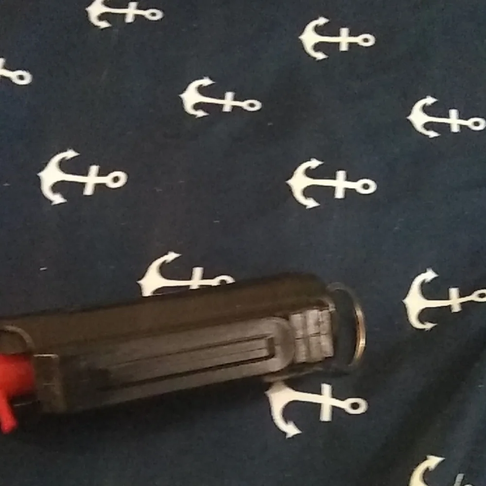 Black Pepper Spray with Red Trigger